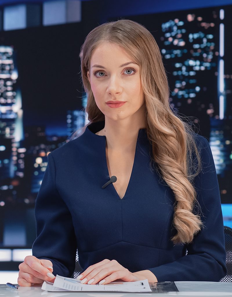 A woman in the early morning commute, noticing the sky